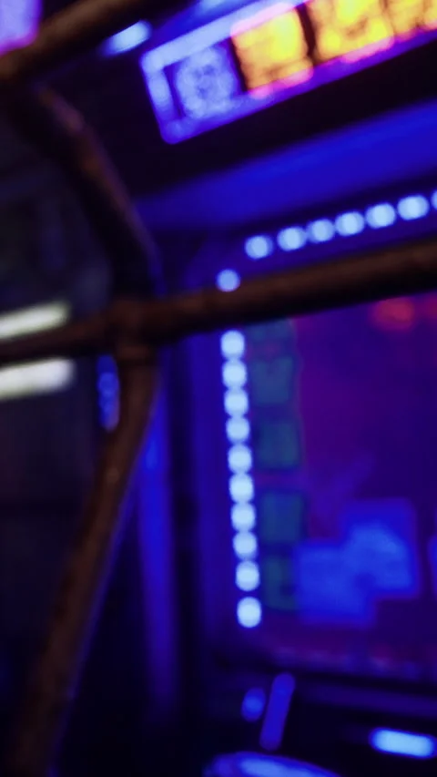 Players enjoy time at arcade with neon lights and vintage machines Stock Footage 334112979