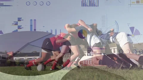 Players forming rugby scrum on grass, pushing and sliding while contesting ball Stockbeeldmateriaal 333671010
