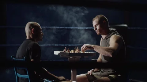 Player's hand makes first move brainstorming tactics. Player strikes Stock Footage 315442807