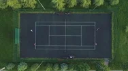 Players Play Tennis On A Green Court. Aerial Top View. Stock Footage