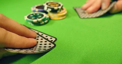 Players playing black jack,they put some chips on the table and reveal the cards Video stock 49909005