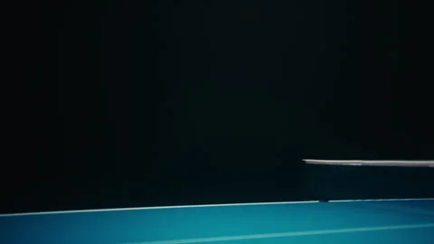 Players playing ping pong in dark room Stock Footage 279242012