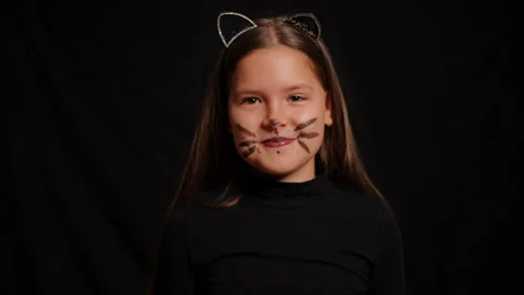 A Playful Cat Themed Portrait Featuring a Joyful Girl Surrounded by Whiskers and Stock Footage 315413862