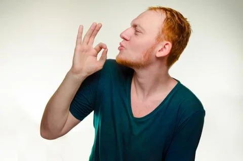 Playful, cheerful, red haired man show gesture perfecto. caucasian male gourmet Stock Photos