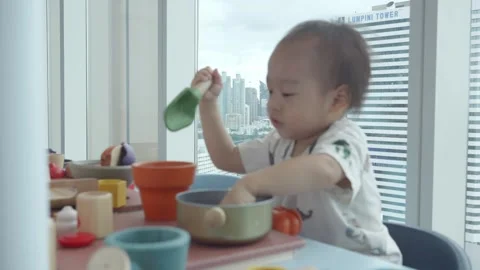 Playful Child Engaged with Colorful Learning Toys Video stock 343556576