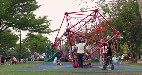 Playful children engaging in fun activities at park playground outdoor setting Vídeos de archivo 334581848