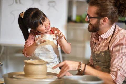 PLayful class making clay pot on pottery workshop.  Creative, hobby ,worksh.. Stock Photos