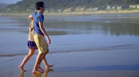Playful couple on beach Stock Footage 52599956