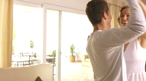 Playful couple falling on couch. Stock Footage 43661345