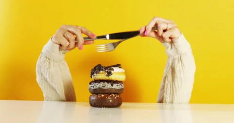 Playful Cutting Motion Over Donut Stack 動画素材 310937441