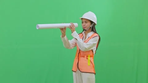 Playful Engineer Using Blueprint as Telescope Stock Footage 331152245
