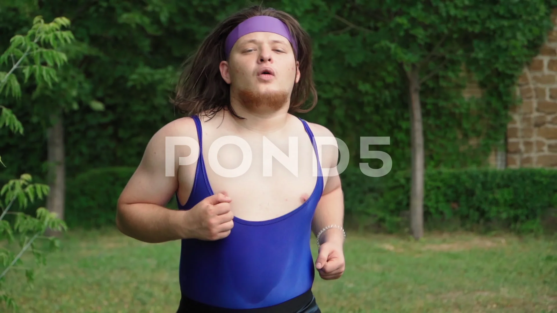 Playful Fat Man with Long Hair in Tight ... | Stock Video | Pond5