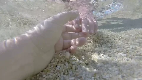Playful hands underwater Stock Footage 81589104
