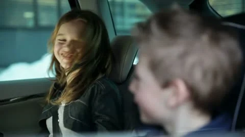 Playful kids in the back of the car while family driving to vacation Stock Footage 27846590