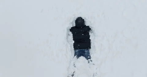 Playful Man In Black Jacket Takes A Snow Dive Stock Footage 277296356