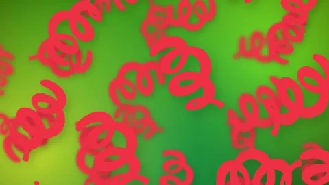 Playful Red Spiral Objects Falling Over Vibrant Green Mesh Background Stock Footage 344379597