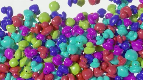 Playful rubber ducks gradually cascading and accumulating on pristine white Stock Footage 309991414