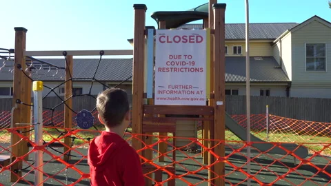 Playground Closure With Boy Looking Covid-19 Pandemic Werri Beach Australia 4of5 Stock Footage