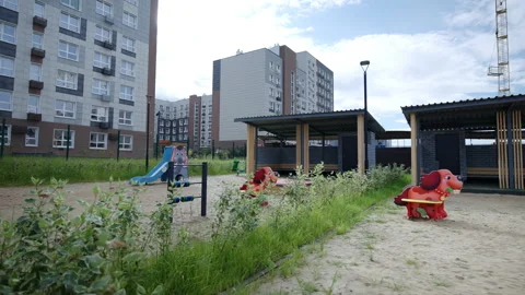 Playground features sand area with dog-shaped benches Vídeos de archivo 333903773