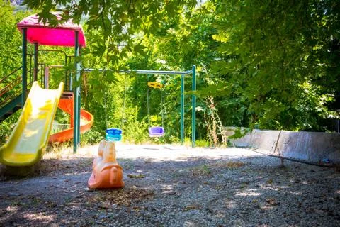 The playground is lit by the sun. Stock Photos