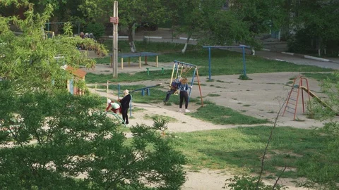 Playground in a nice green courtyard Stock Footage 107988457