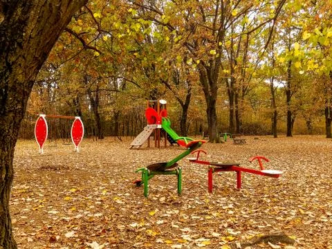 Playground in the park surrounded with forest Stock Photos