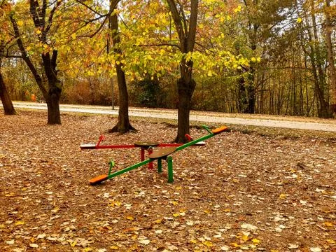 Playground in the park surrounded with forest Stock Photos
