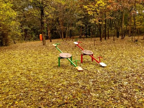Playground in the park surrounded with forest Stock Photos