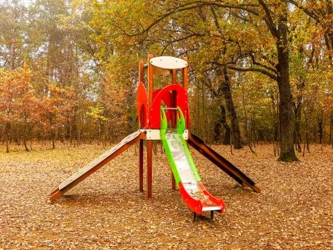 Playground in the park surrounded with forest Stock Photos