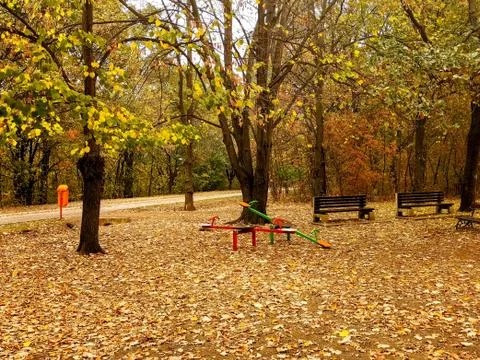 Playground in the park surrounded with forest Stock Photos