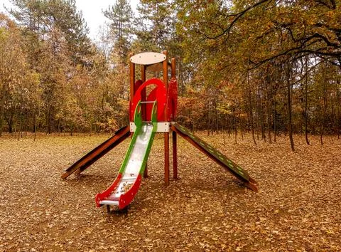 Playground in the park surrounded with forest Stock Photos