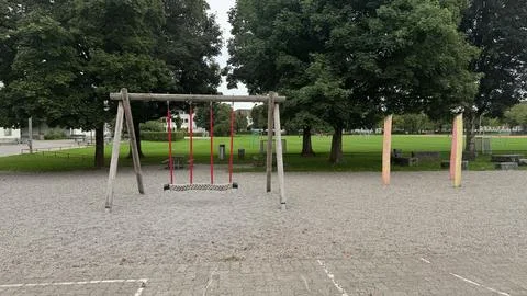 Playground in public park with climbing frames and swings leisure place for.. Stock Photos