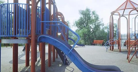 Playground with slide and climbing frames in sunny park setting Ilustração Stock