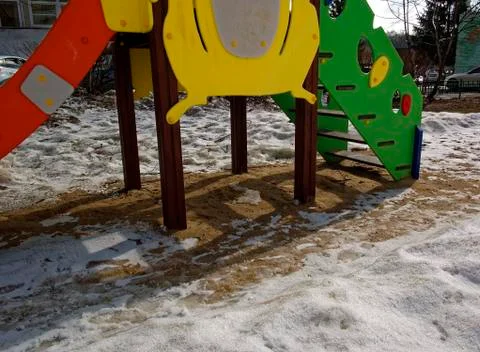 Playground in the snow in spring Stock Photos