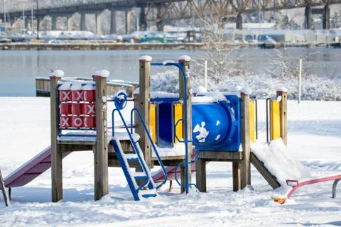 A playground structure covered in snow . Stock Photos