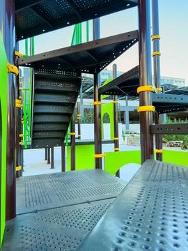 Playground structure with slides and climbing areas located in a park durin.. Stock Photos