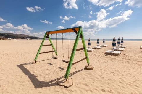 Playground swing on the beach Foto stock