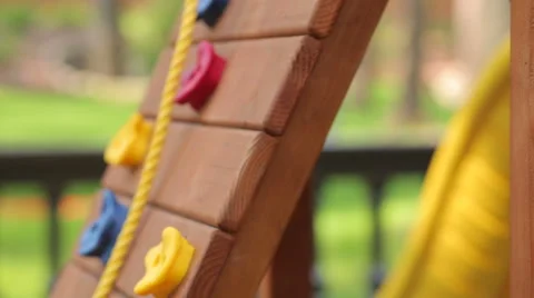Playground swing outside the house Stock Footage 63592758