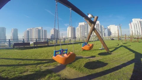 Playground swing in a park Vidéo 105347884