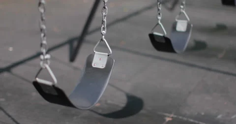 Playground swings empty sad Stock Footage 41534096