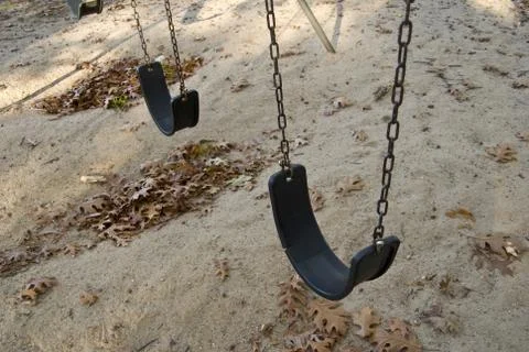 Playground swings Stock Photos