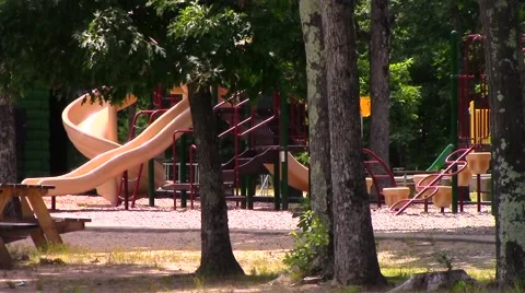 Playground through the trees with picnic table on left Video stock 40155628