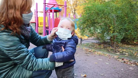On the playground wearing a mask Stock Footage 142265736