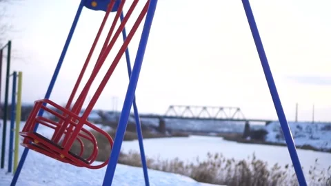 Playground in winter by the river Stock Footage 146778909