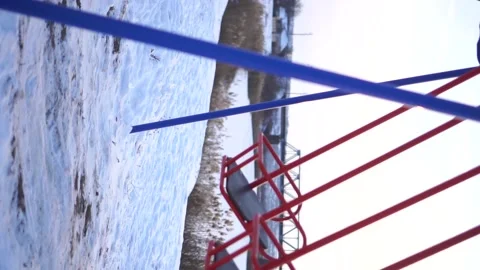 Playground in winter by the river Stock Footage 146778916