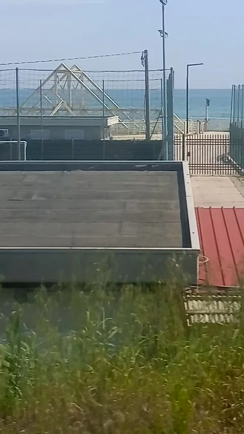 Playgrounds in front of the sea Stock Footage 281012111