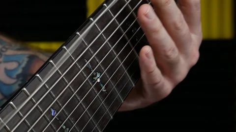 Playing 9 String Guitar Close Up 9th String Vibrating Video stock 96866256