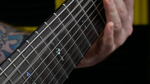 Playing 9 String Guitar Close Up On Neck Stings Vibrating Stock Footage 96866286