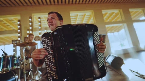 Playing an accordion player at an event Stock Footage 204152076
