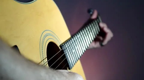 Playing an acoustic guitar Stock Footage 25964634